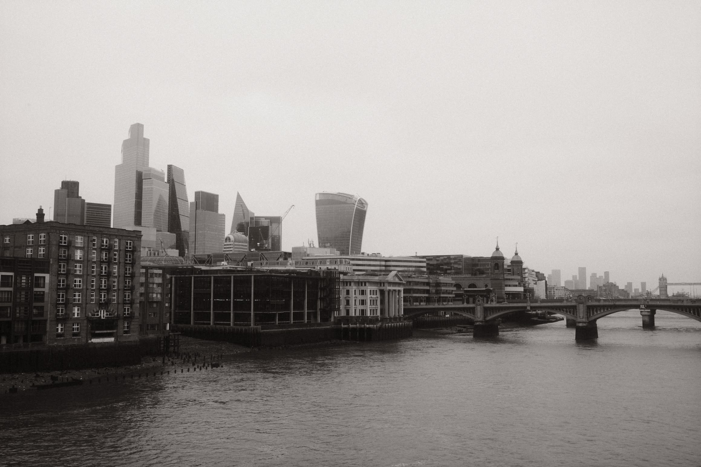 A view east over London from Millennium Bridge. In the distance you can see London Bridge and Tower Bridge.