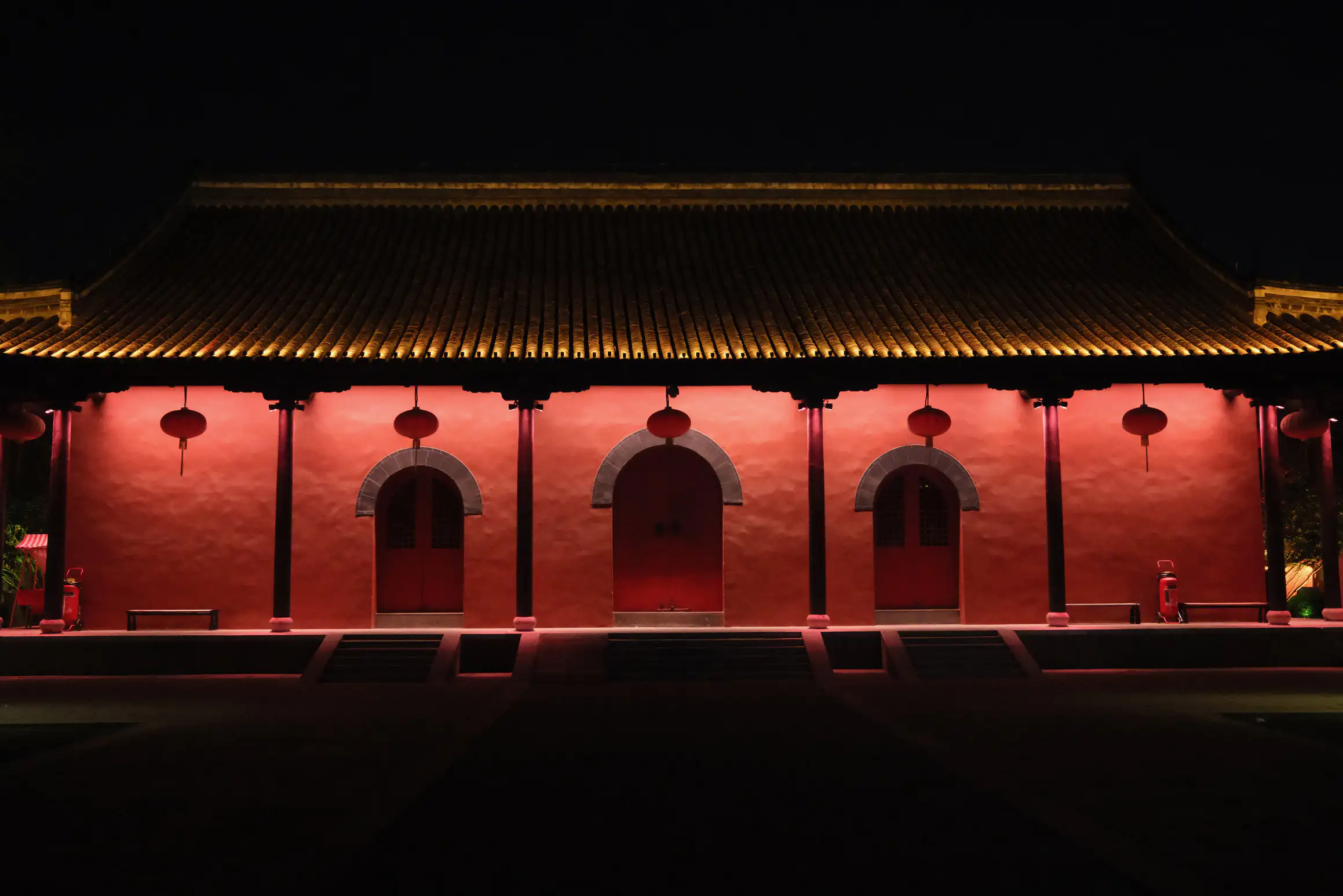 a quiet temple at night, missing the crowds present during the day