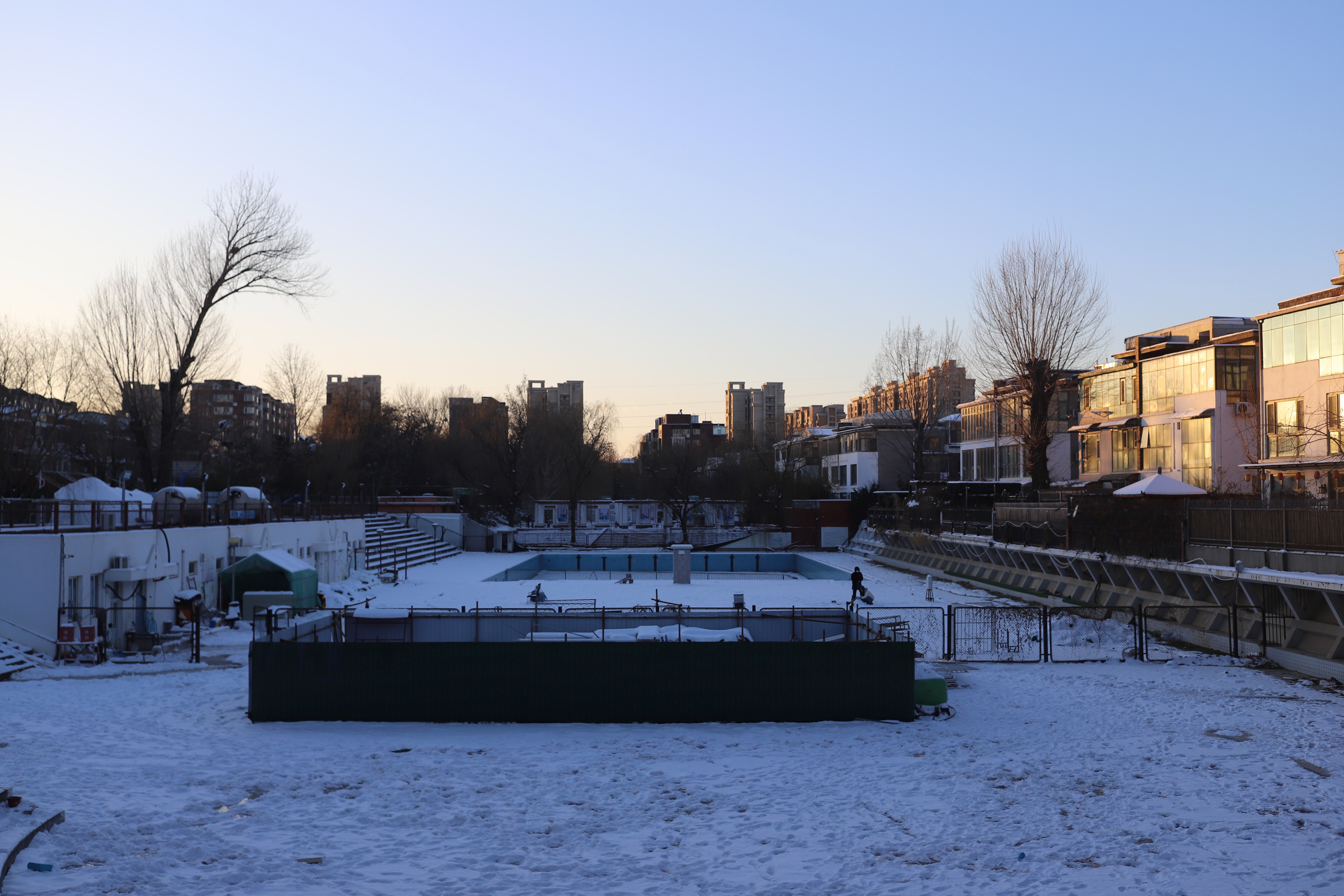 The remains of an outdoor swimming pool, unused since the opening of a new sports facility, bring back memories of summers in Beijing.