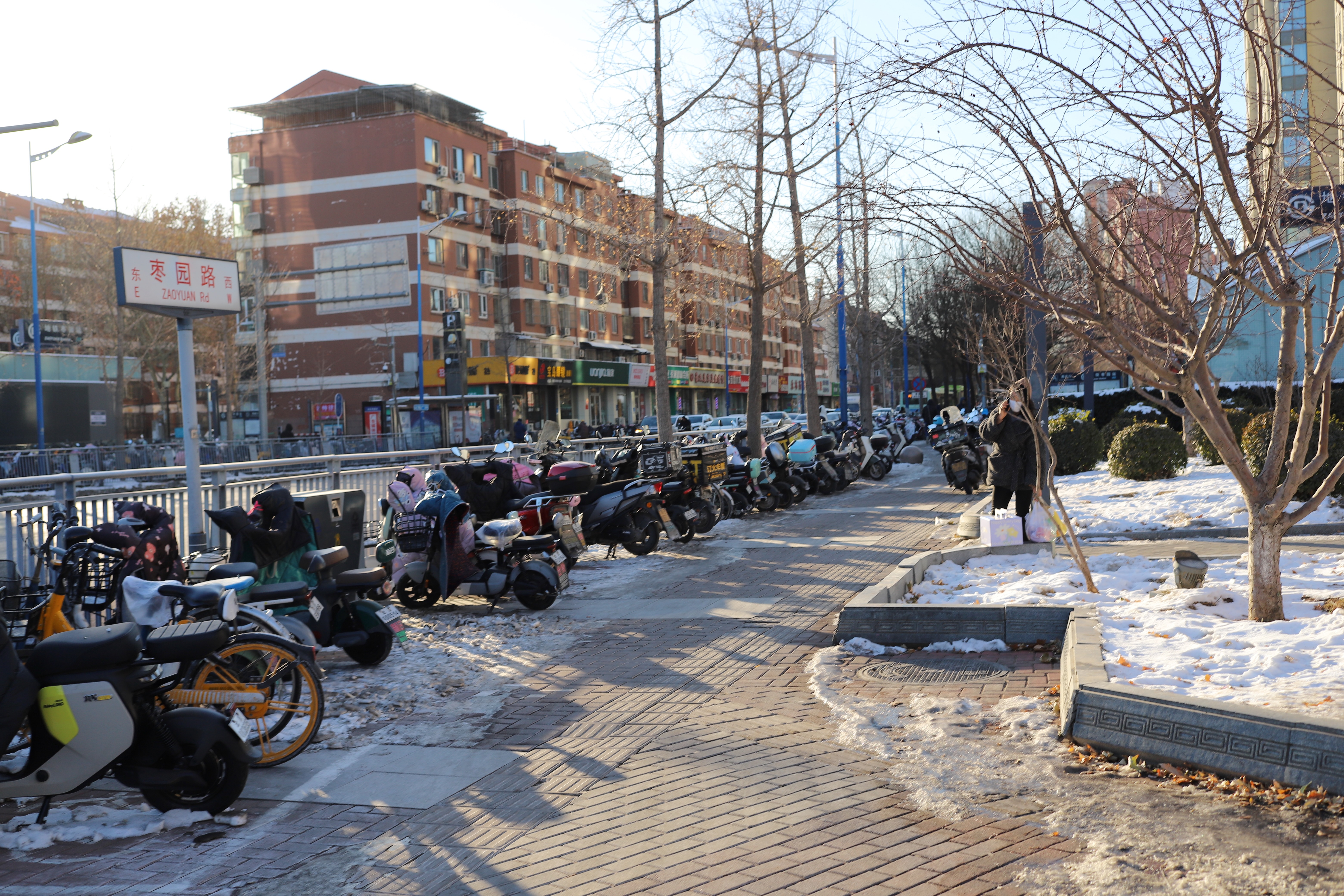 Bikes parked outside the exit of a subway station.