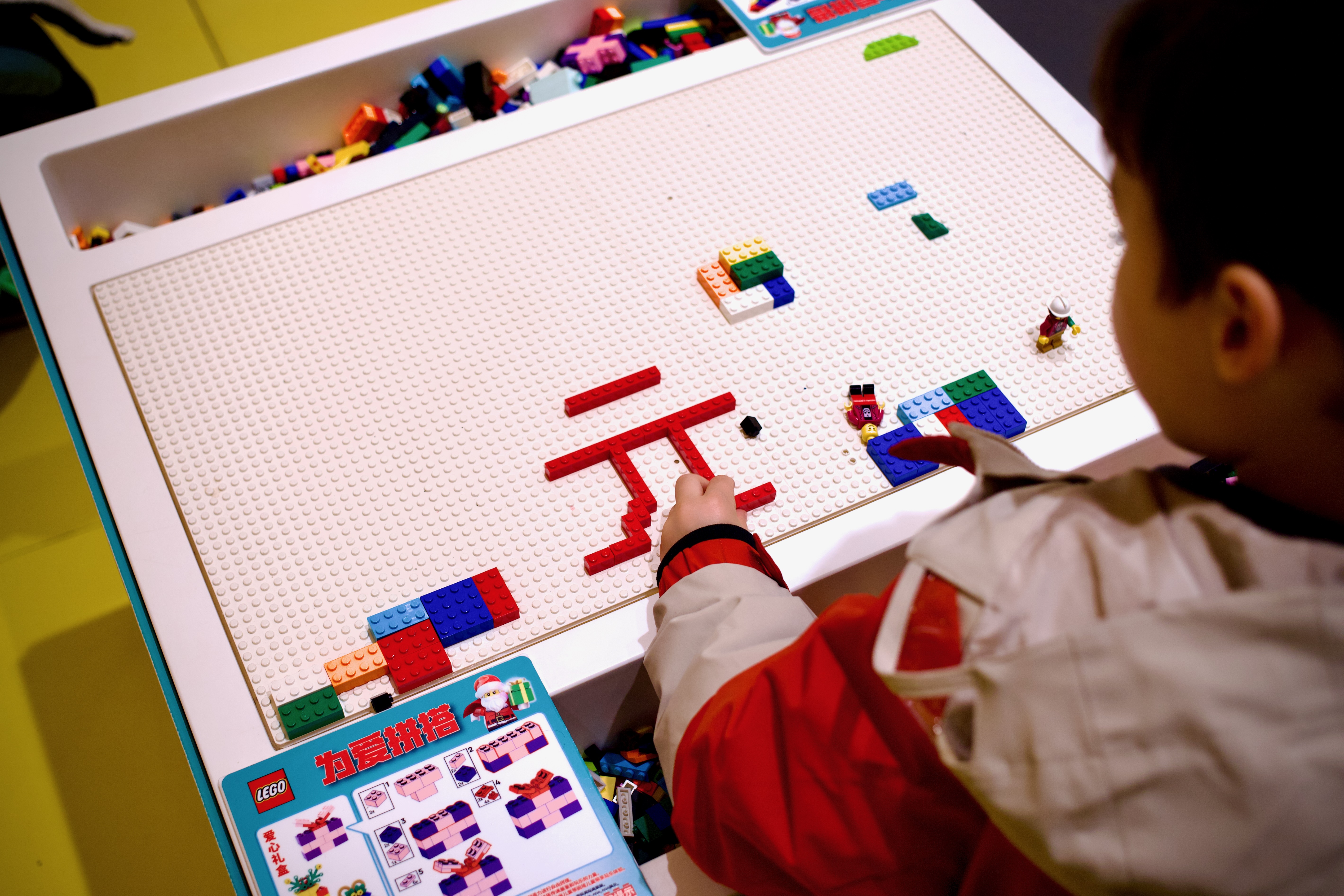 My son left his name in Lego on the play table.