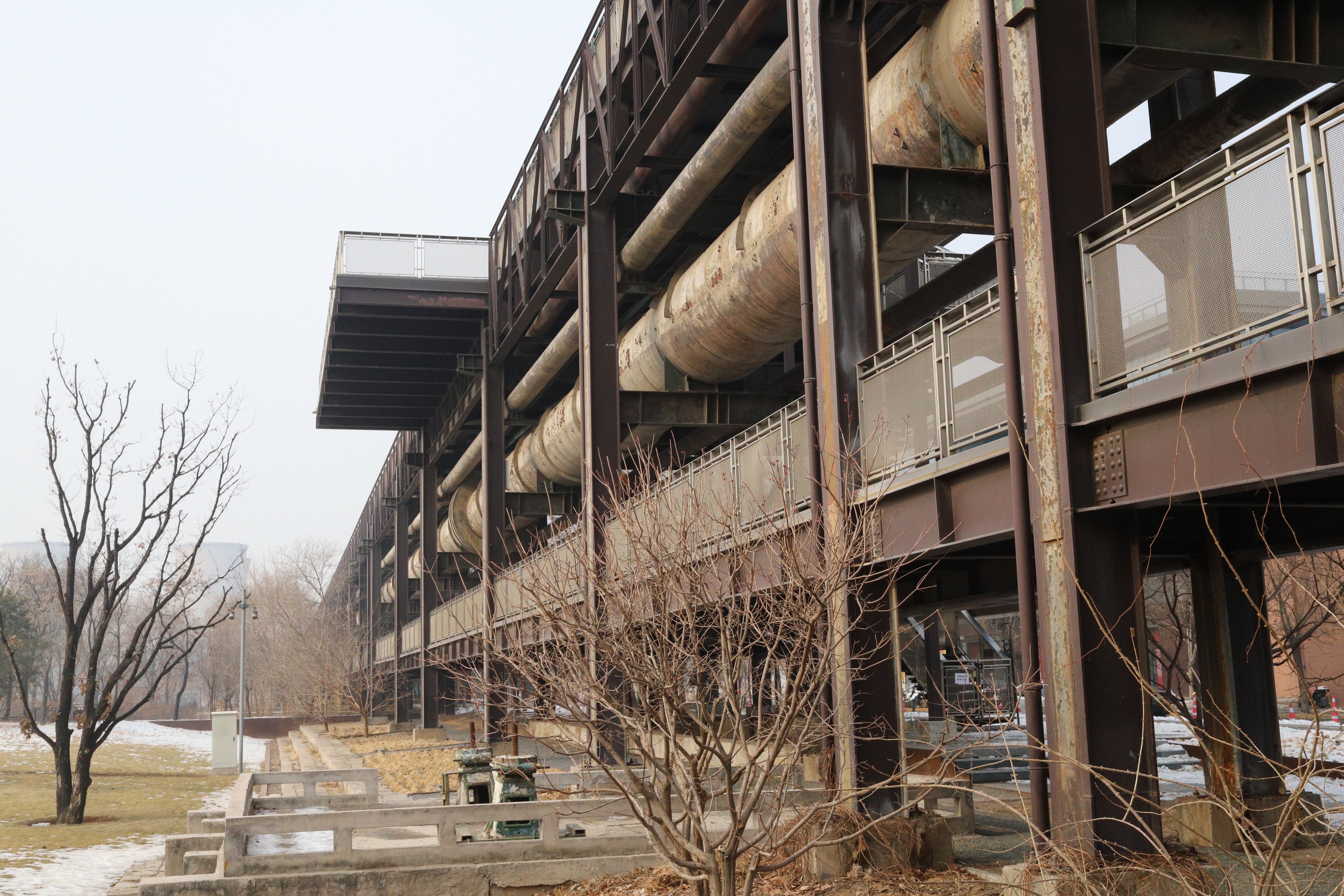 Large pipes run between many of the buildings in Shougang. These have been turned into a walkway from which you can view the park.