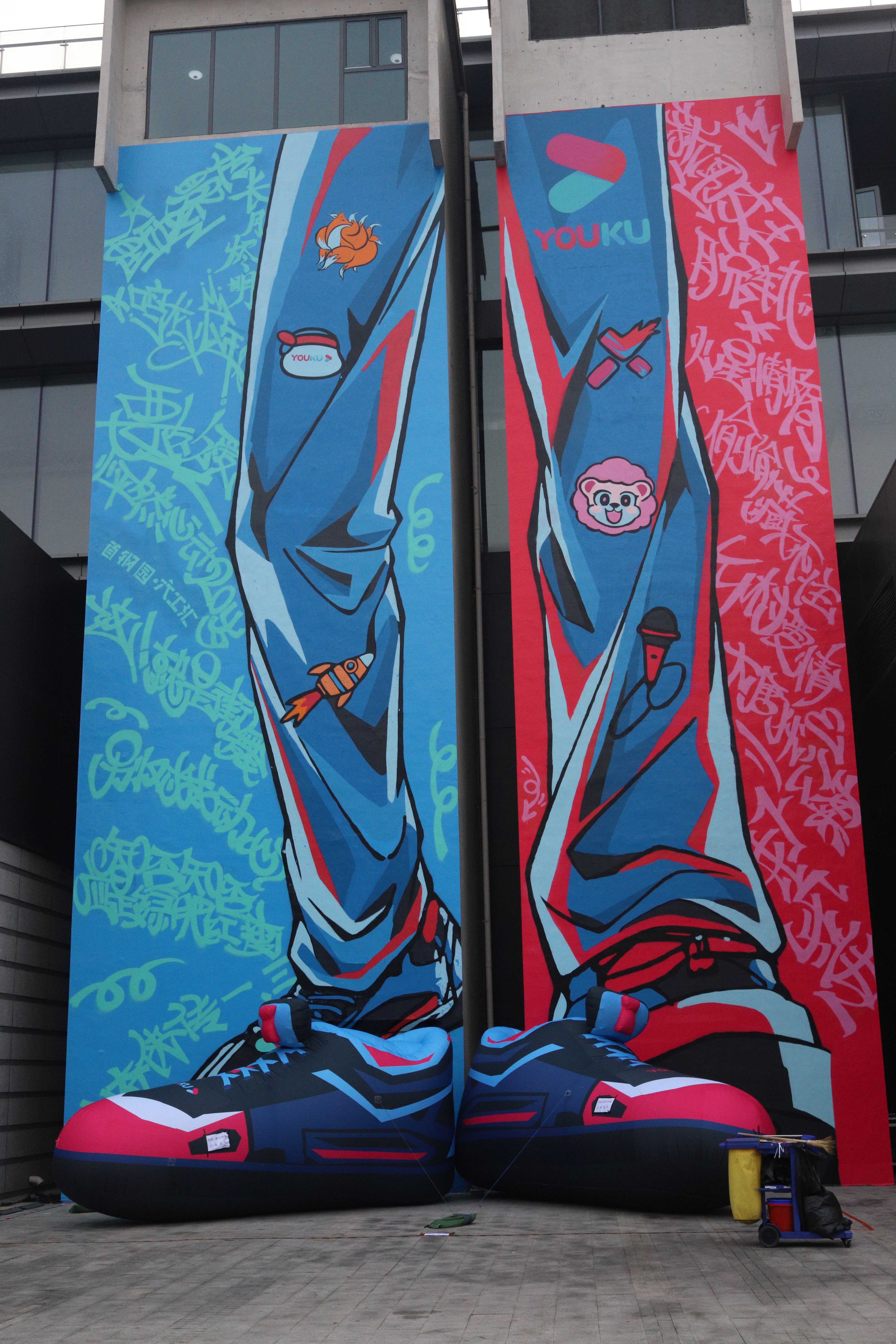 A giant pair of Youku branded shoes.